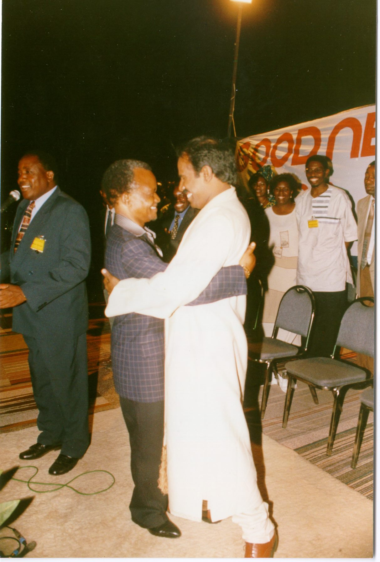 Dr. K.A. Paul embracing an African head of state at a Good News gathering