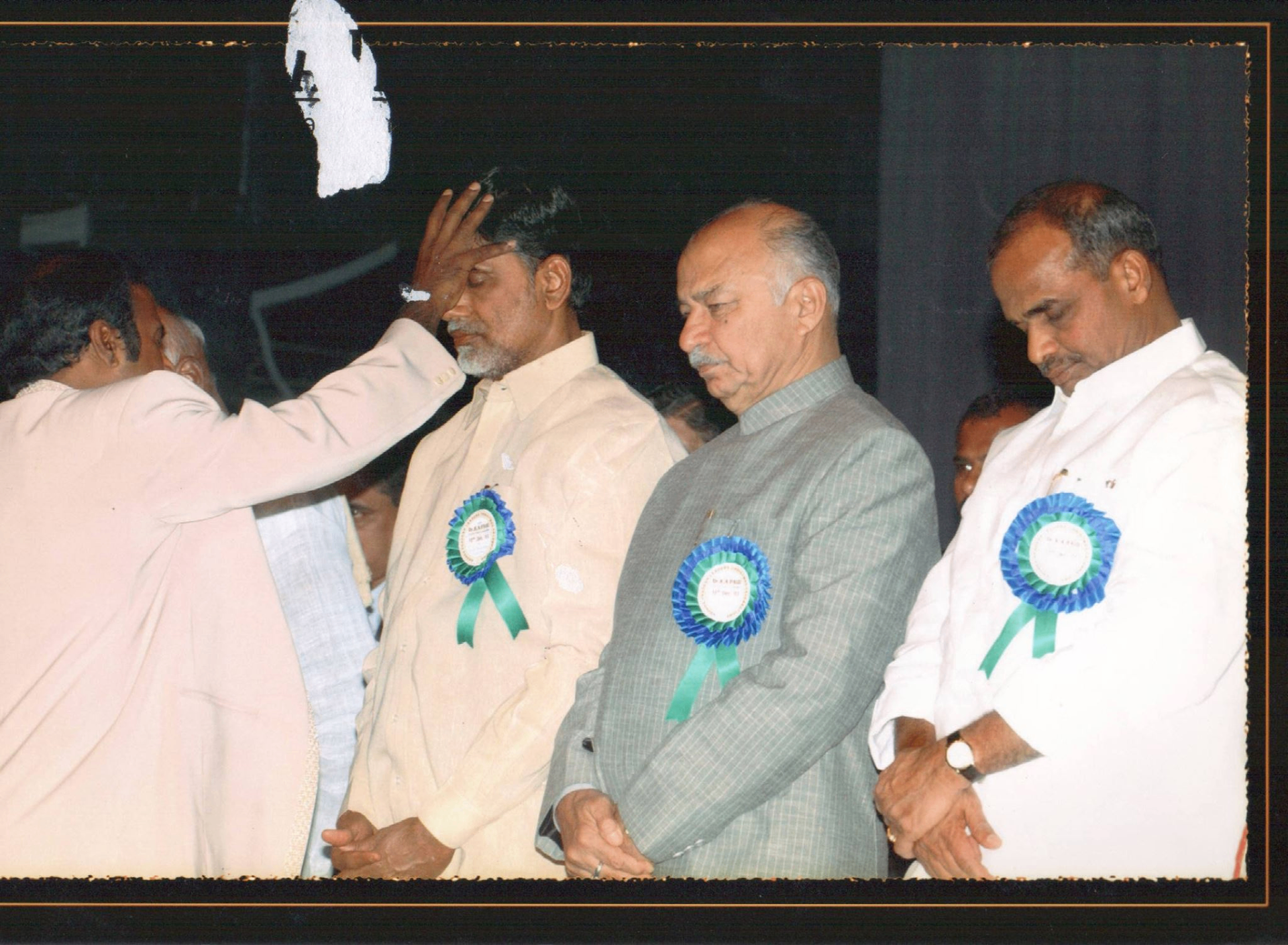 Dr. K.A. Paul praying over Indian political leaders on stage