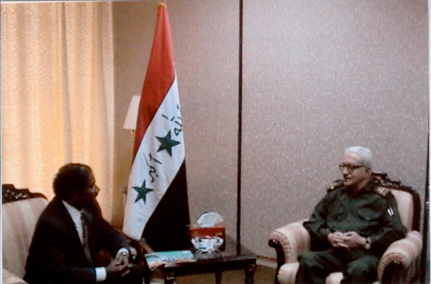 Dr. K.A. Paul in a formal meeting with an Iraqi military official